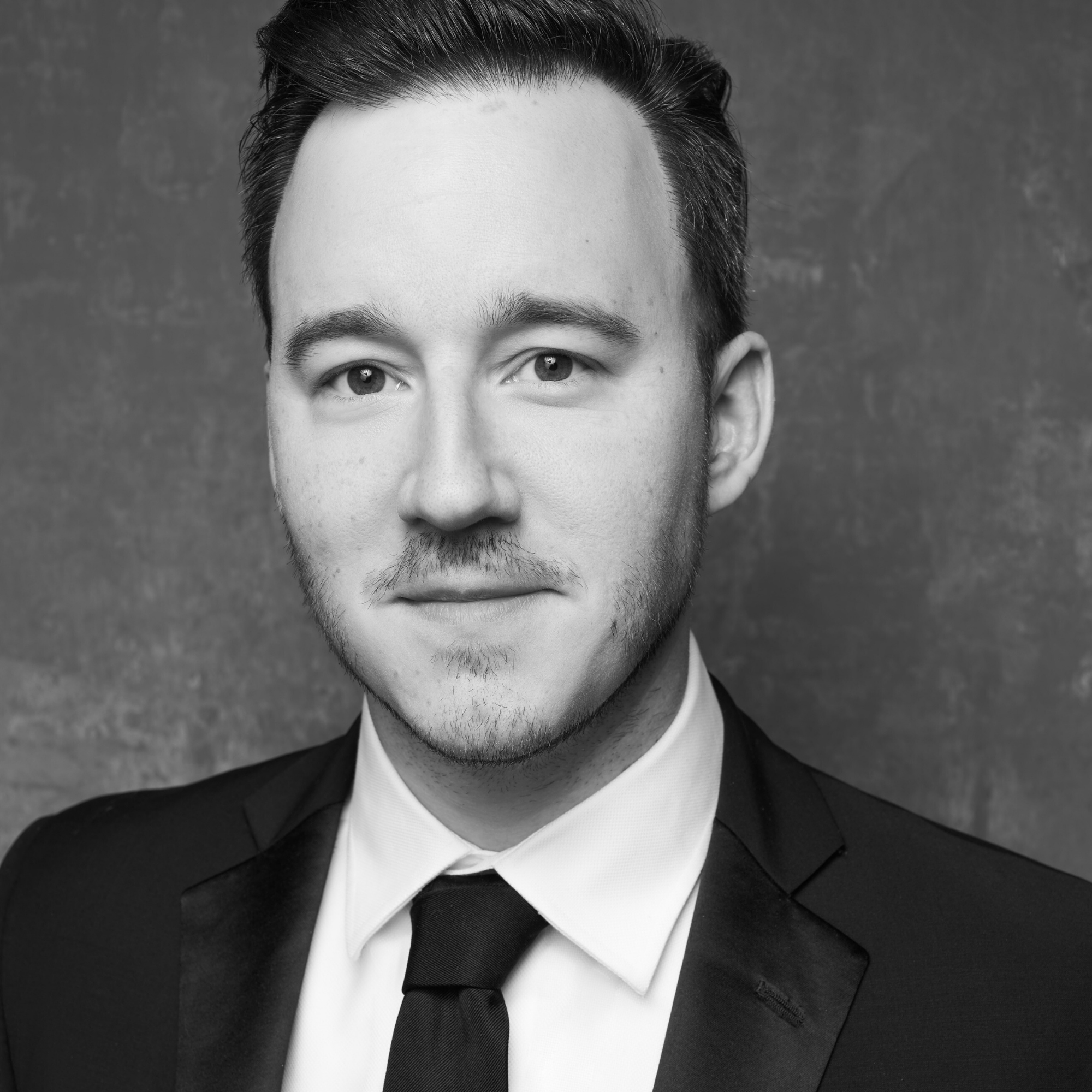 Black-and-white headshot of Alex Desocio.