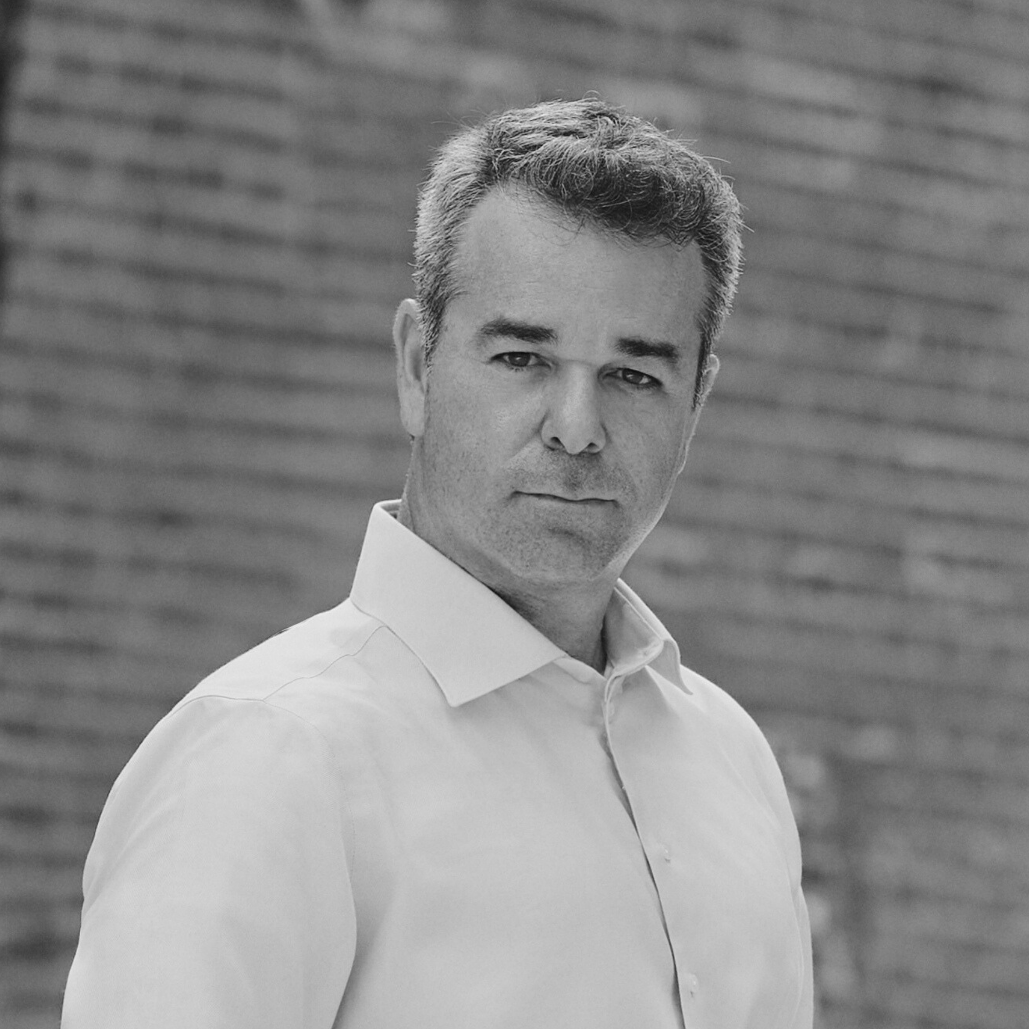Black-and-white headshot of Tomer Zvulun.