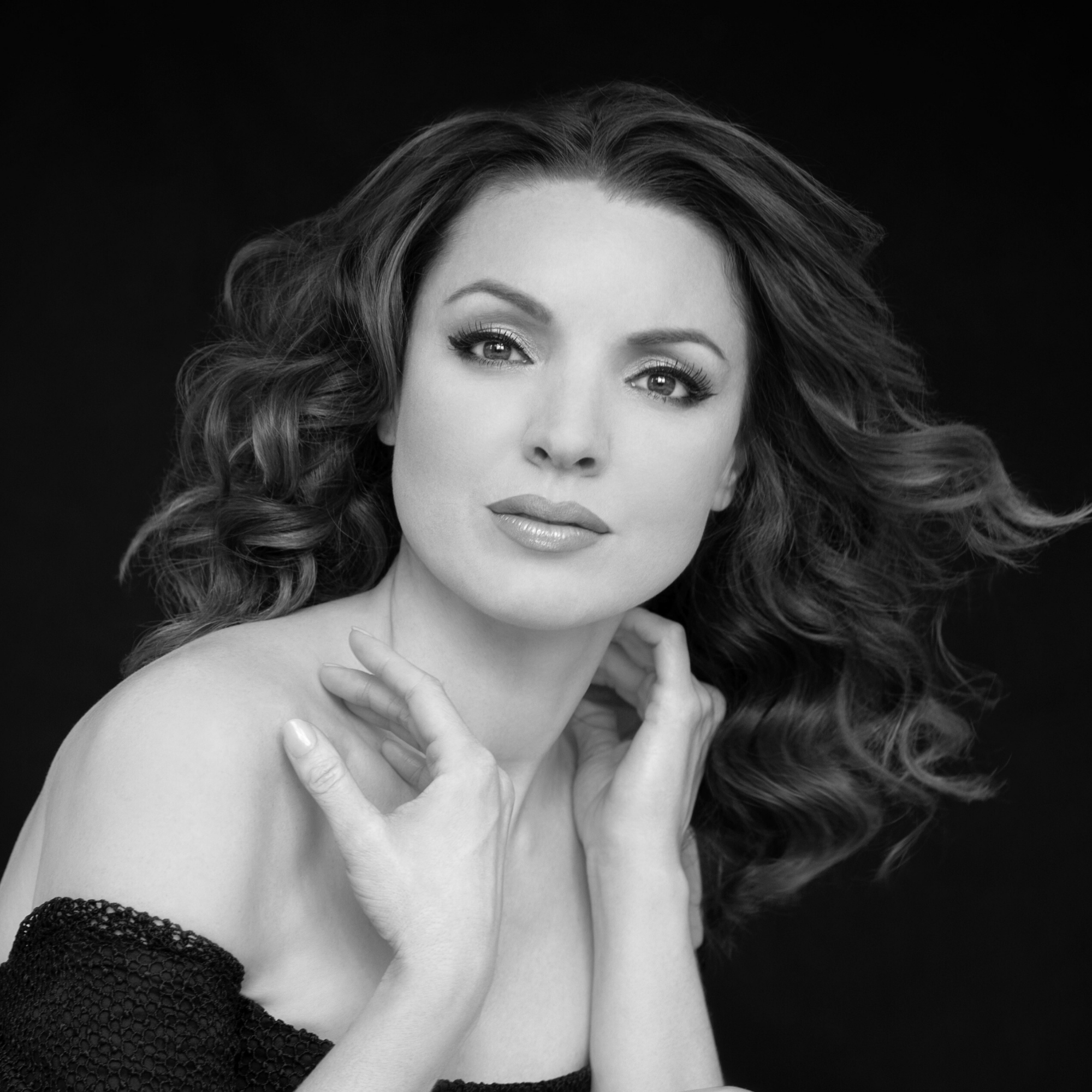 Black-and-white headshot of Sarah Joy Miller.